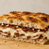 Golosa — Porchetta, smoked provola, caramelized onion and crushed almonds