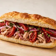 Marino — Tuna, sun-dried tomato, red onion and chives